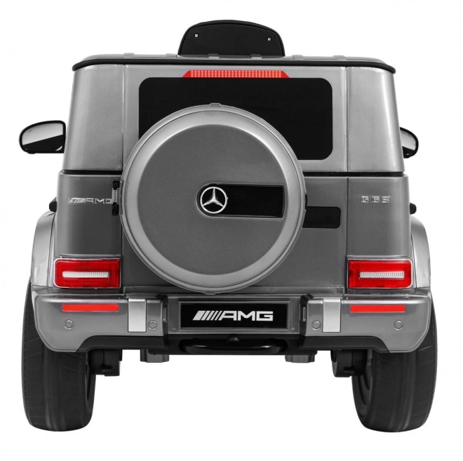 Mercedes AMG G63 für Kinder Silberlack + Fernbedienung + MP3 LED + langsamer Start + EVA + Gurte