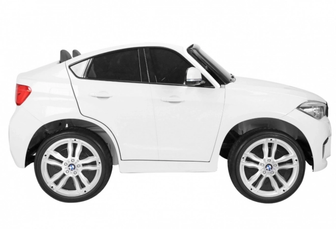 BMW X6M XXL pro 2 Kinder Weiß + Fernsteuerung + Eco-Leder + Sicherheitsgurte + langsamer Start + MP3 USB + LED