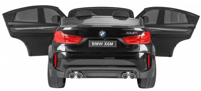 BMW X6M XXL pro 2 Kinder schwarz + Fernbedienung + Öko-Leder + Sicherheitsgurte + Langsame Anfahrt + MP3 USB + LED-Diode