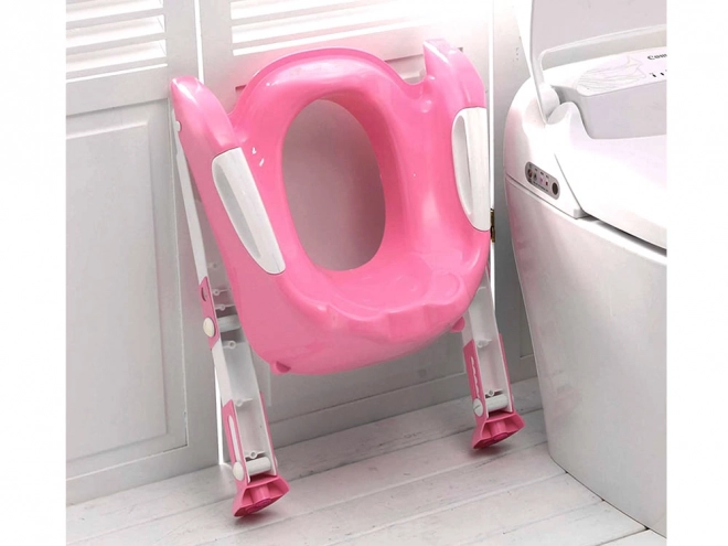 Toilette Stufenaufsatz in Rosa