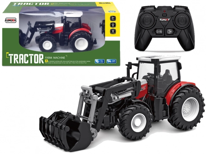 Ferngesteuerter roter Traktor mit beweglicher Schaufel