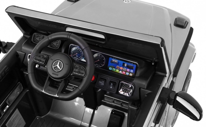 Mercedes AMG G63 für Kinder Silberlack + Fernbedienung + MP3 LED + langsamer Start + EVA + Gurte