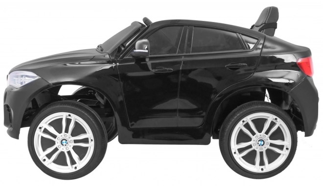 BMW X6M Elektrisches Kinderauto Schwarz + Fernbedienung + EVA + Langsamer Start + Audiopanel + LED-Diode