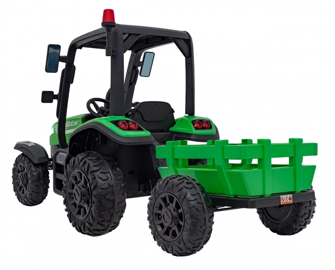 Kindertraktor mit grünem Anhänger
