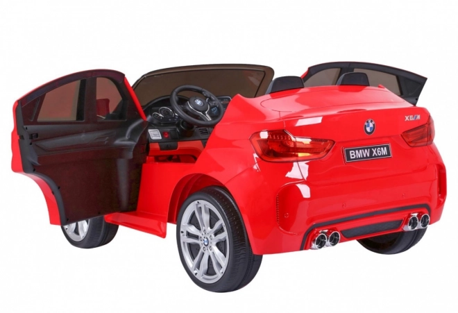 BMW X6M XXL pro 2 Kinder Rot + Fernbedienung + Ökoleder + Sicherheitsgurte + Langsamer Start + MP3 USB + LED-Leuchte