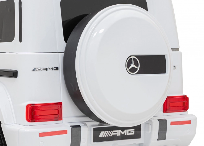 Mercedes AMG G63 für Kinder weiß + Fernbedienung + MP3 LED + langsamer Start + EVA + Gurte