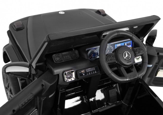 Mercedes AMG G63 für Kinder Lack schwarz + Fernbedienung + MP3 LED + langsamer Start + EVA + Gurte