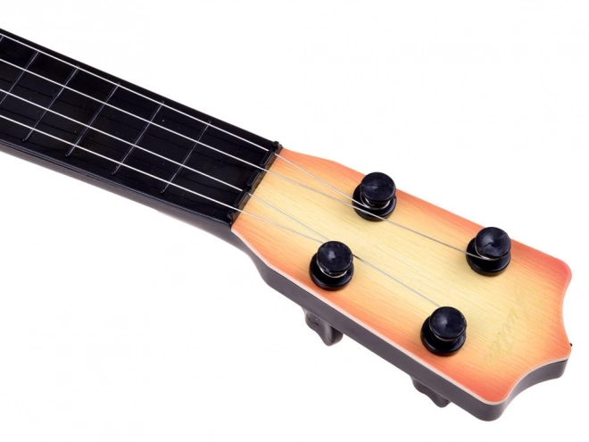 Kindergitarre mit 4 Saiten und Plektrum – hellbraun