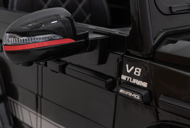 Mercedes AMG G63 für Kinder schwarz + Fernbedienung + MP3 LED + langsamer Start + EVA + Gurte