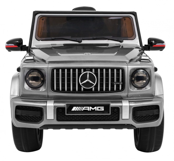 Mercedes AMG G63 für Kinder Silberlack + Fernbedienung + MP3 LED + langsamer Start + EVA + Gurte