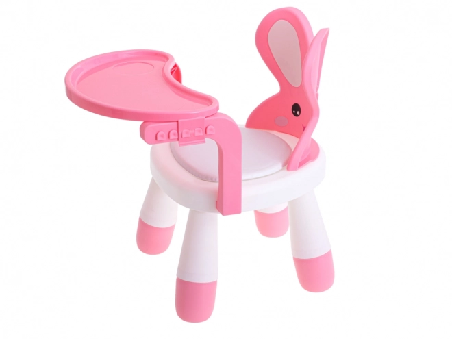Kleiner rosa Hochstuhl und Tisch zum Füttern und Spielen