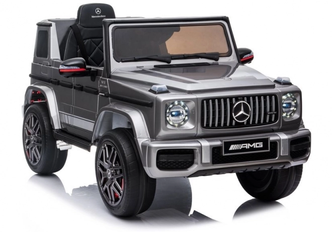 Silberner Mercedes G63 AMG Elektroauto für Kinder