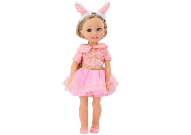 Elegante Spielpuppe mit langen Haaren und rosa Kleid