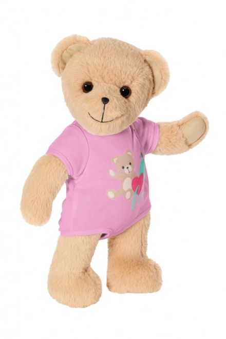 Babypuppe mit süßem Teddybär in rosa Outfit