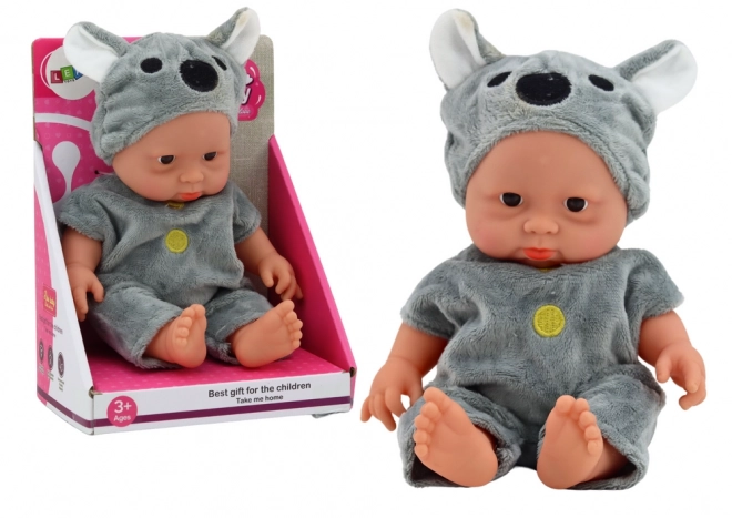 Niedliches Babypuppe mit Koala Mütze