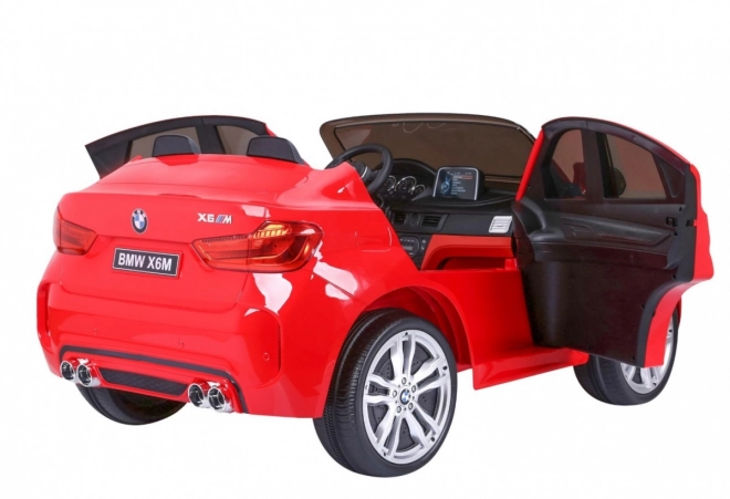 BMW X6M XXL pro 2 Kinder Rot + Fernbedienung + Ökoleder + Sicherheitsgurte + Langsamer Start + MP3 USB + LED-Leuchte
