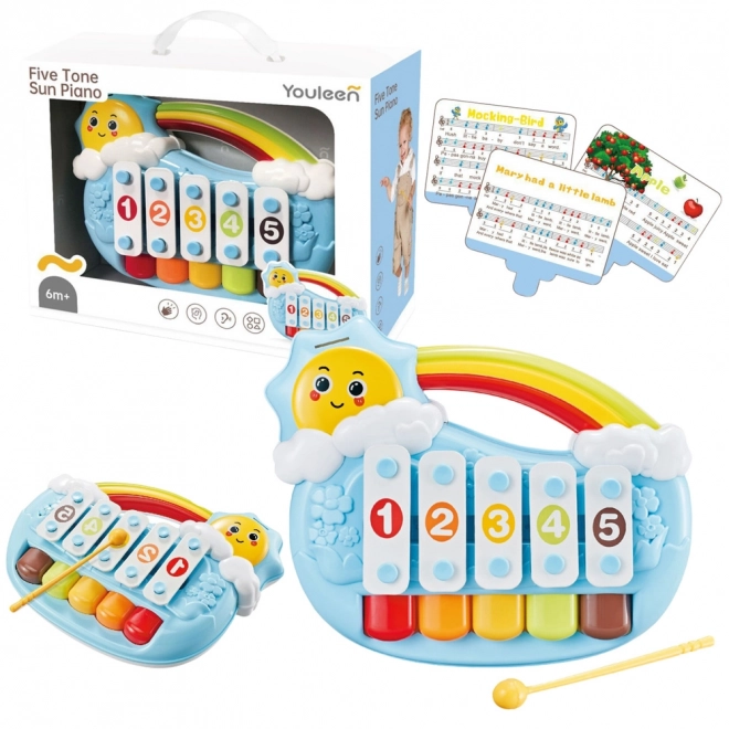Blaues Kinderspielzeug-Klavier mit Sonnenmotiv