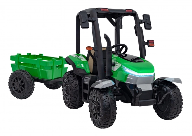 Kindertraktor mit grünem Anhänger