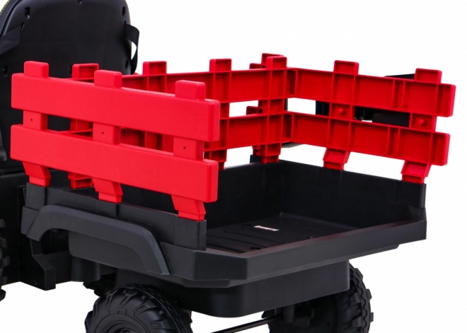 Titan-Traktor mit rotem Anhänger