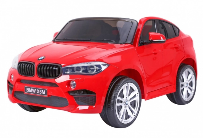 BMW X6M XXL pro 2 Kinder Rot + Fernbedienung + Ökoleder + Sicherheitsgurte + Langsamer Start + MP3 USB + LED-Leuchte
