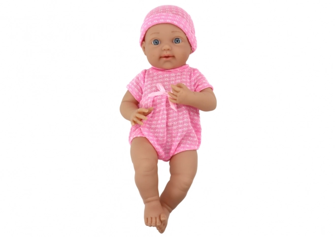 Puppenbaby im Rosa Outfit mit Mütze und Schnuller