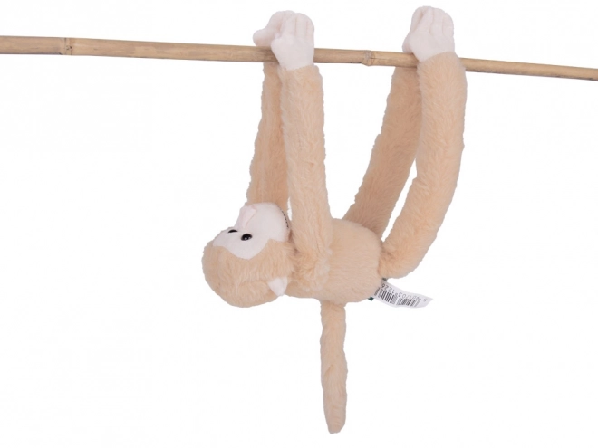 Beigefarbener hängender Maskottchen-Affe