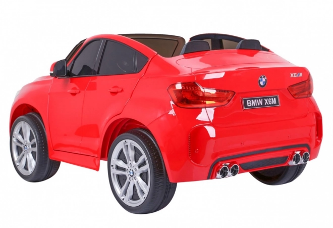 BMW X6M XXL pro 2 Kinder Rot + Fernbedienung + Ökoleder + Sicherheitsgurte + Langsamer Start + MP3 USB + LED-Leuchte