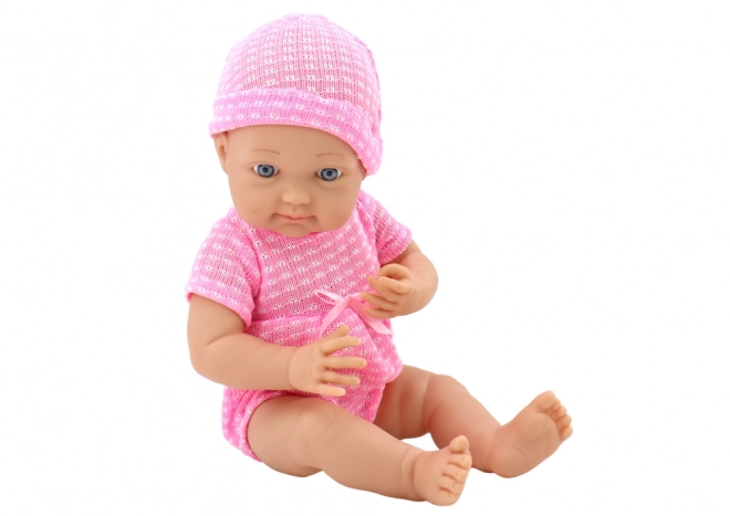 Puppenbaby im Rosa Outfit mit Mütze und Schnuller