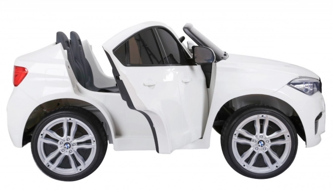 BMW X6M XXL pro 2 Kinder Weiß + Fernsteuerung + Eco-Leder + Sicherheitsgurte + langsamer Start + MP3 USB + LED