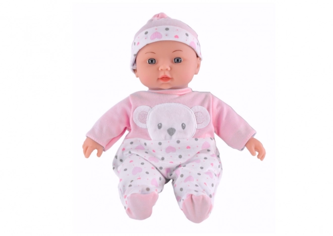 Babypuppe mit rosa Pyjama und Bärchenmütze mit Geräuschen