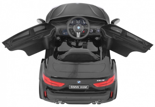 BMW X6M Elektrisches Kinderauto Schwarz + Fernbedienung + EVA + Langsamer Start + Audiopanel + LED-Diode