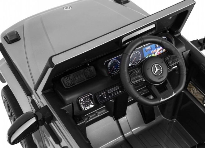 Mercedes AMG G63 für Kinder Silberlack + Fernbedienung + MP3 LED + langsamer Start + EVA + Gurte