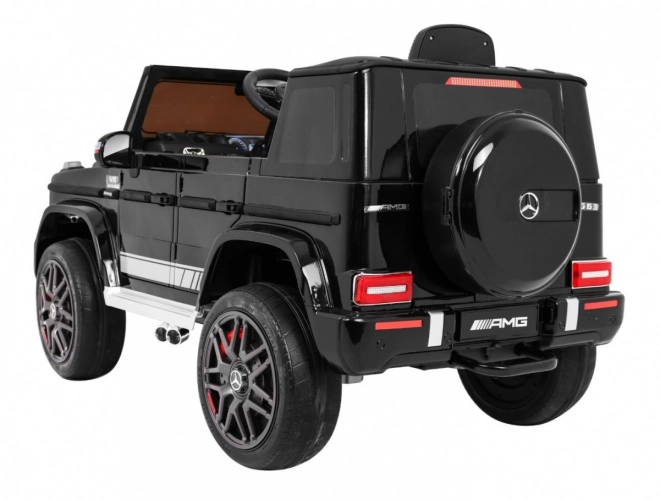 Mercedes AMG G63 für Kinder Lack schwarz + Fernbedienung + MP3 LED + langsamer Start + EVA + Gurte