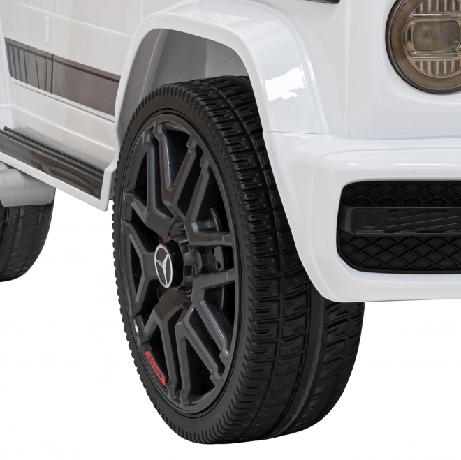 Mercedes AMG G63 für Kinder weiß + Fernbedienung + MP3 LED + langsamer Start + EVA + Gurte