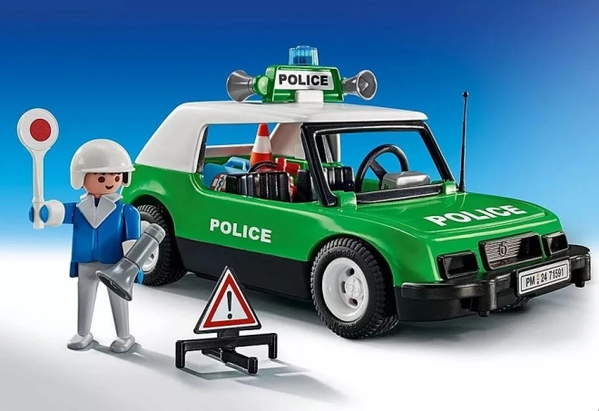 Klassischer Polizeiwagen mit Figur