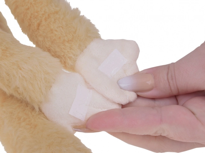 Beigefarbener hängender Maskottchen-Affe