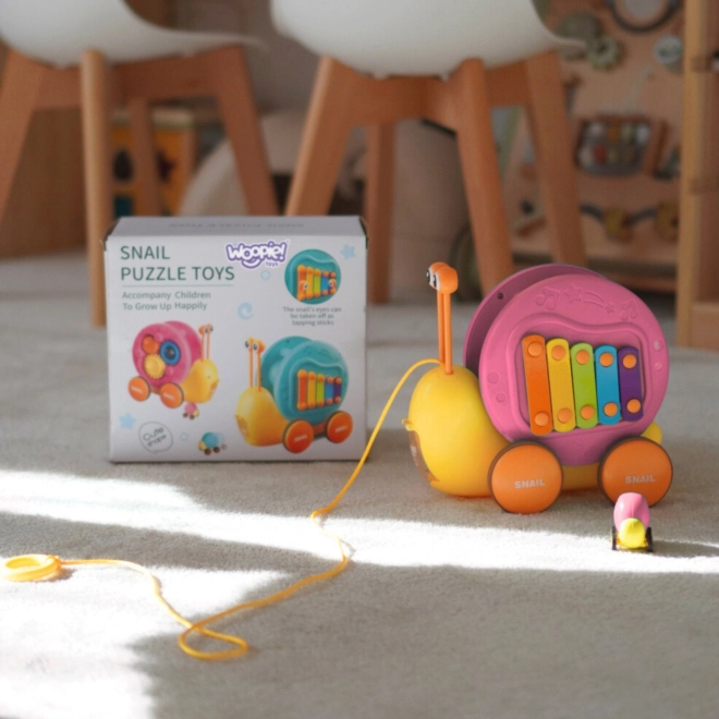 Multifunktionales WOOPIE Spielzeug Schnecke mit Xylophon und Autoabschuss