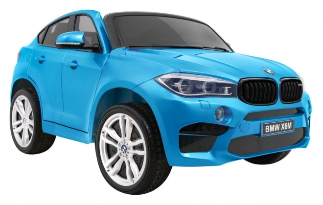 BMW X6M XXL pro 2 Kinder Blaue Farbe + Pilot + Eco-Leder + Sicherheitsgurte + Langsamer Start + MP3 + LED