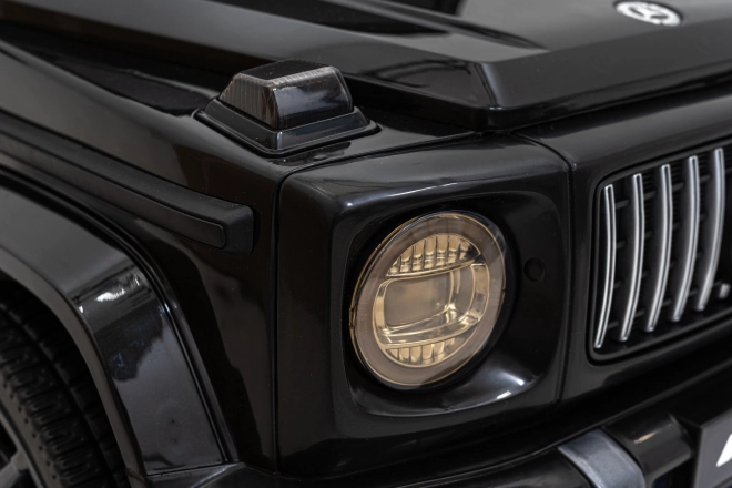 Mercedes AMG G63 für Kinder schwarz + Fernbedienung + MP3 LED + langsamer Start + EVA + Gurte