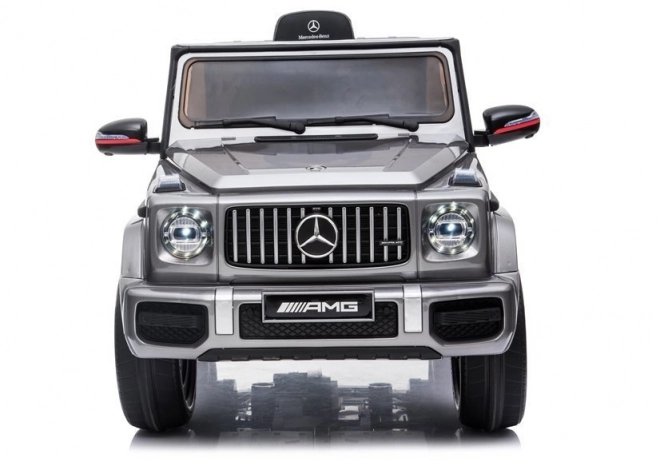 Silberner Mercedes G63 AMG Elektroauto für Kinder