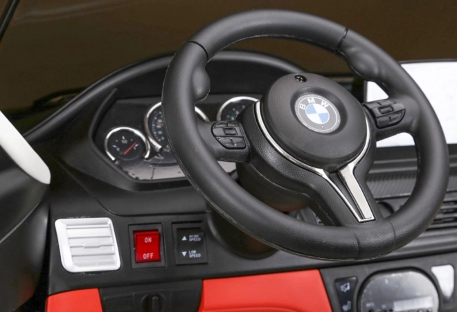 BMW X6M XXL pro 2 Kinder Weiß + Fernsteuerung + Eco-Leder + Sicherheitsgurte + langsamer Start + MP3 USB + LED