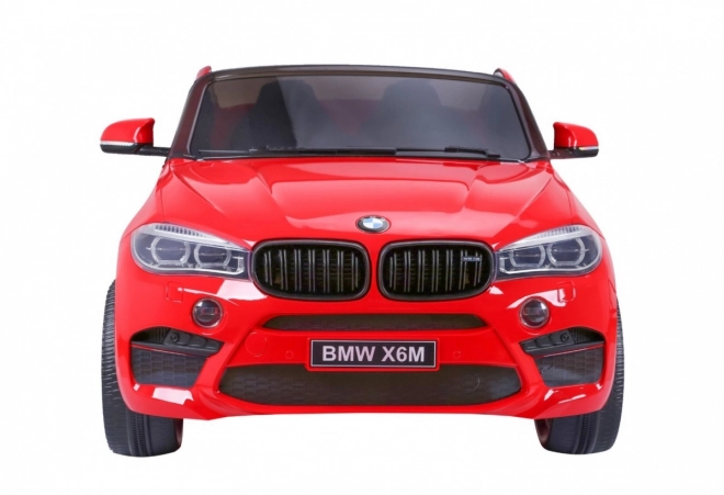 BMW X6M XXL pro 2 Kinder Rot + Fernbedienung + Ökoleder + Sicherheitsgurte + Langsamer Start + MP3 USB + LED-Leuchte