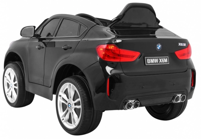BMW X6M Elektrisches Kinderauto Schwarz + Fernbedienung + EVA + Langsamer Start + Audiopanel + LED-Diode