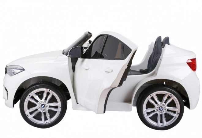 BMW X6M XXL pro 2 Kinder Weiß + Fernsteuerung + Eco-Leder + Sicherheitsgurte + langsamer Start + MP3 USB + LED