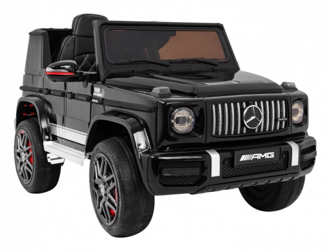 Mercedes AMG G63 für Kinder Lack schwarz + Fernbedienung + MP3 LED + langsamer Start + EVA + Gurte