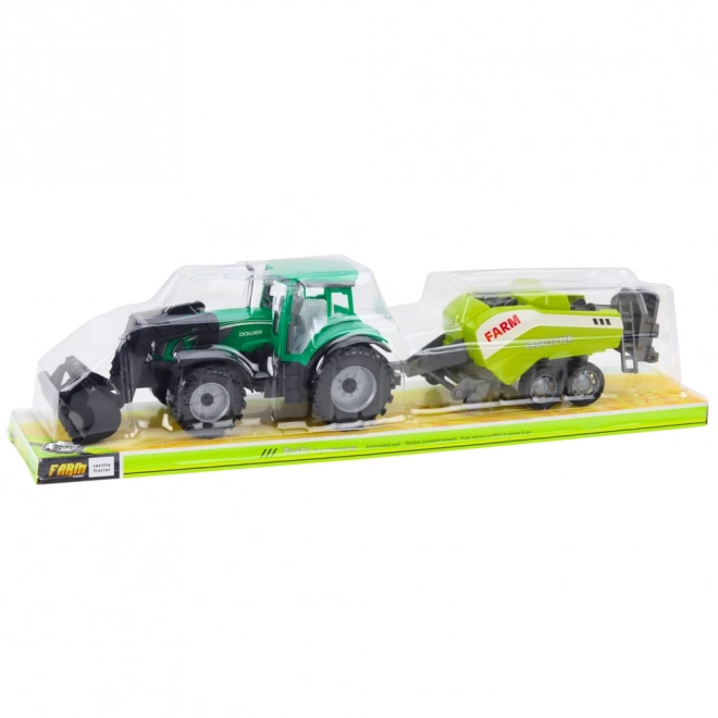Grüner Traktor mit Lader und kompatibler Ballenpresse