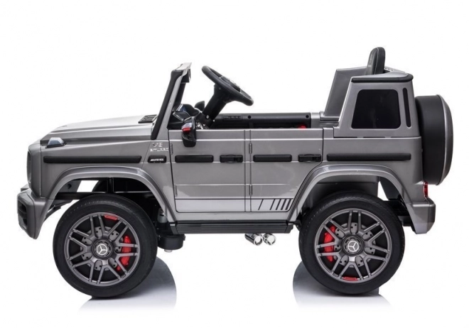 Silberner Mercedes G63 AMG Elektroauto für Kinder