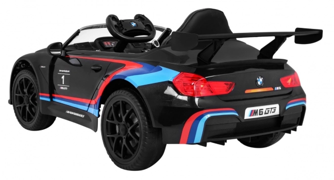 BMW M6 GT3 Spielzeugauto auf Batterie für Kinder schwarz + Belüftung + MP3-Sounds Lichter + Fernbedienung