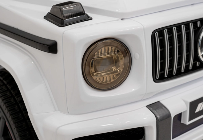 Mercedes AMG G63 für Kinder weiß + Fernbedienung + MP3 LED + langsamer Start + EVA + Gurte
