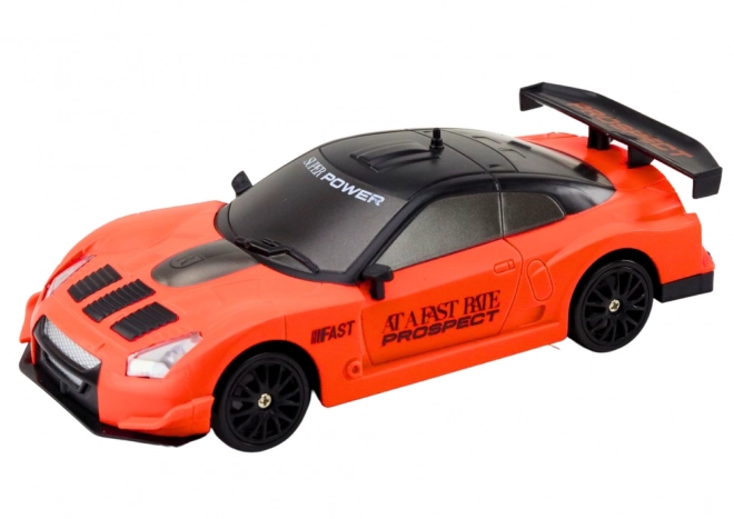Ferngesteuertes Sportauto mit Wechselrädern in Orange